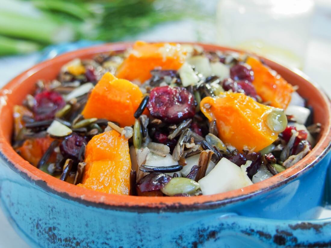 Bowl of butternut squash wild rice salad with cranberries and fennel