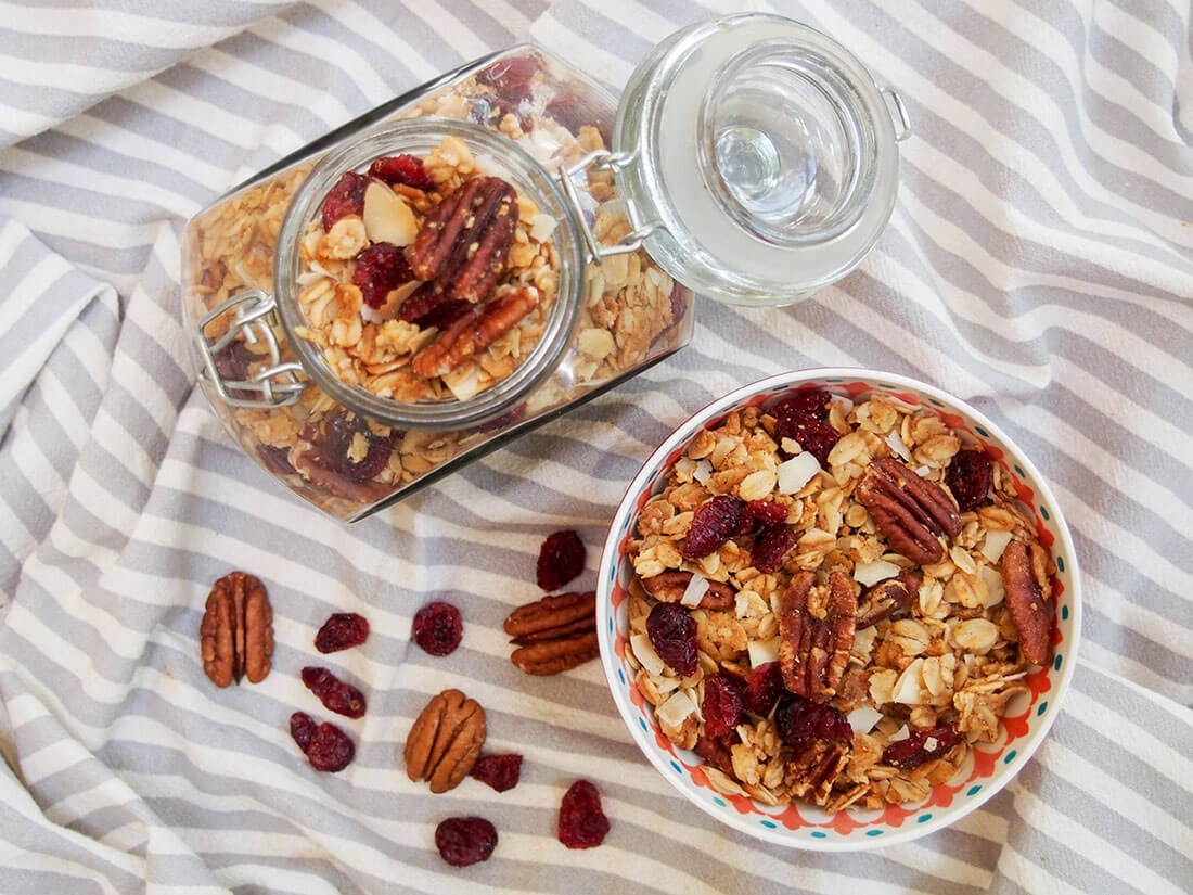 Homemade granola recipe - some in bowl, rest in jar from overhead
