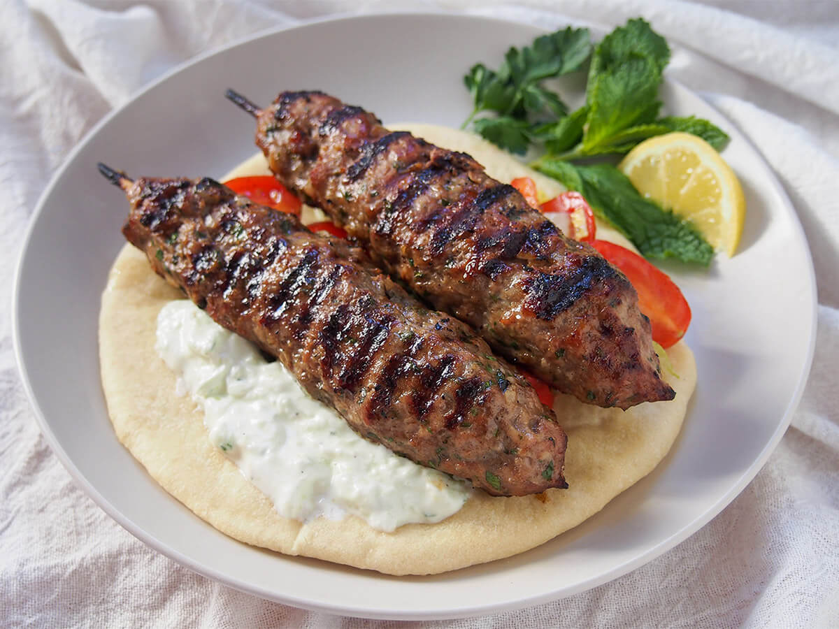 lamb kofta or kofte on pita with cacik under kebab