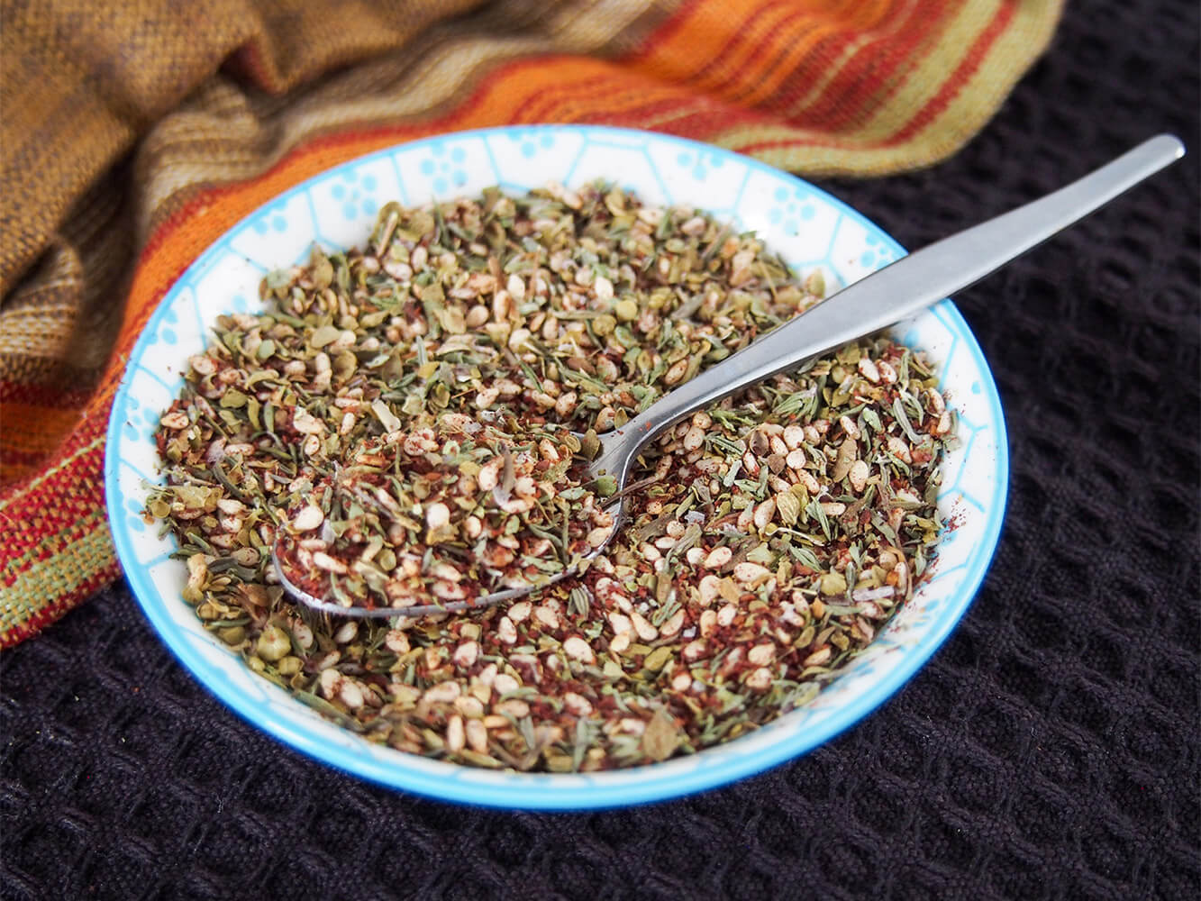 bowl of za'atar spice blend with spoon in it